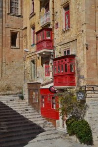 red wooden balconies in Valletta